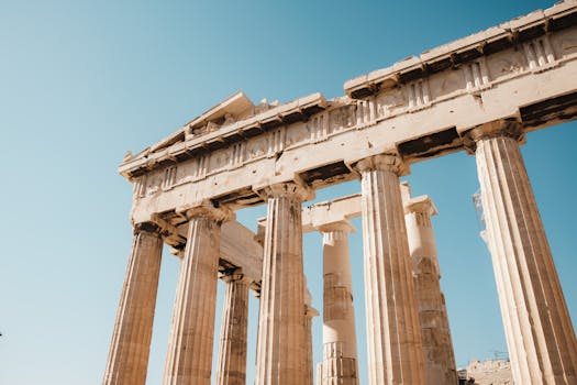 Low angle view of Parthenon columns in Athens, Greece, showcasing ancient architecture.